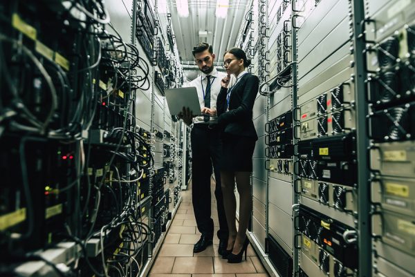 Technicians reviewing server infrastructure at a Phoenix data center during IT asset disposition